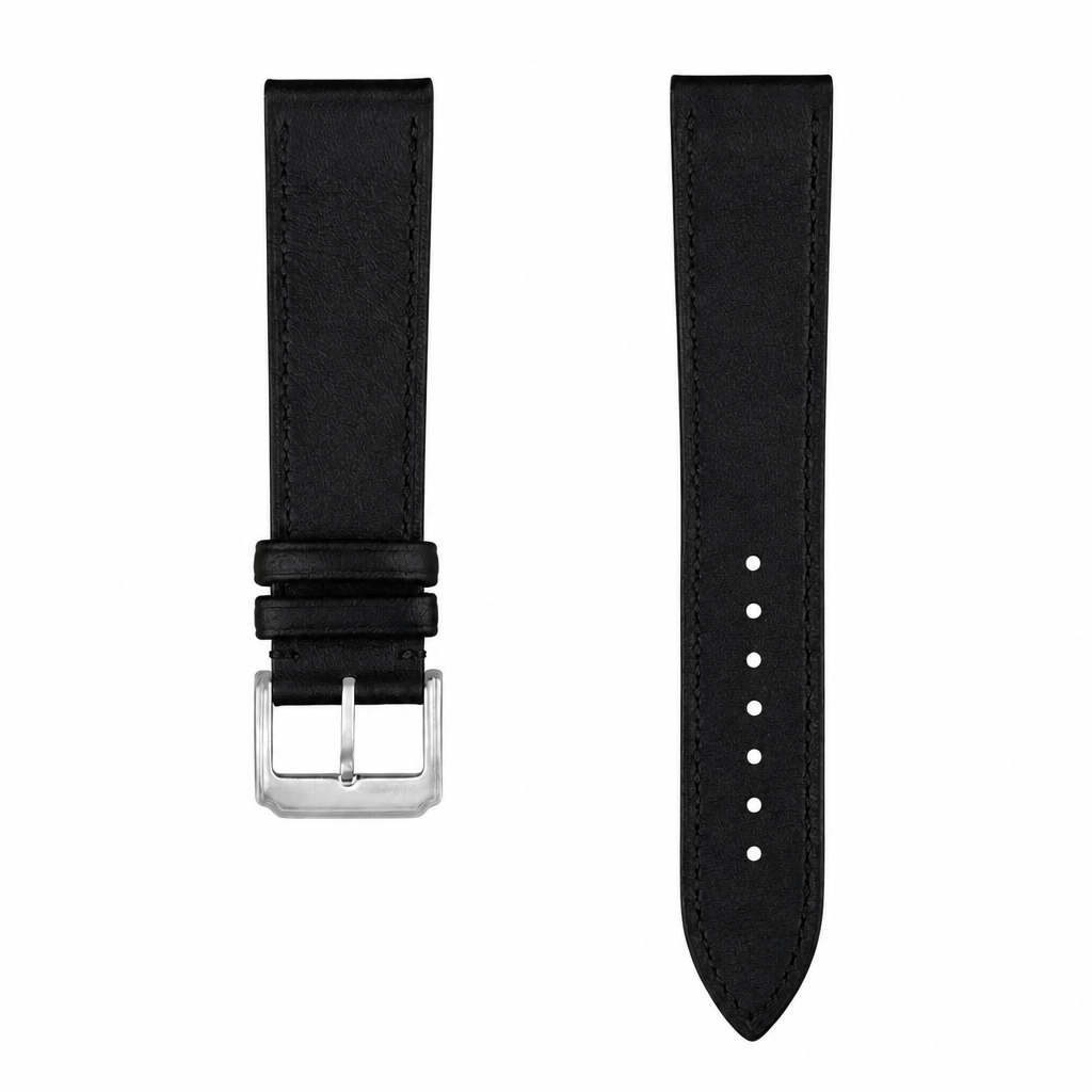 Black leather watch strap with silver buckle on white background
